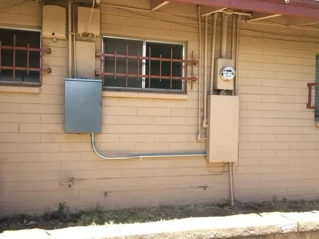 Exterior meter, disconnect and conduit run on a commercial building - Orozco Electric