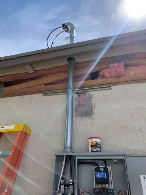 Exterior conduit riser, security camera and commercial panel install - Orozco Electric