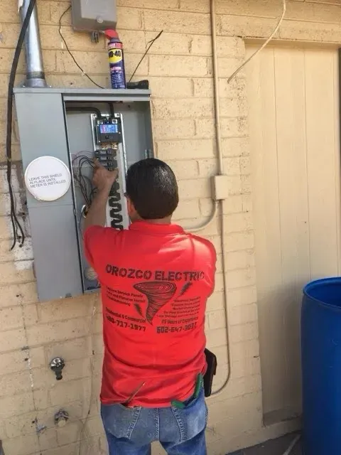 Orozco Electric technician wiring a residential breaker panel - Mesa AZ